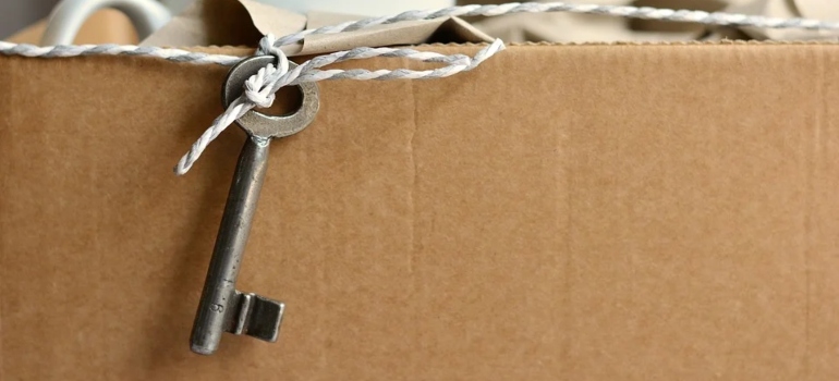 a key hanging from a moving box