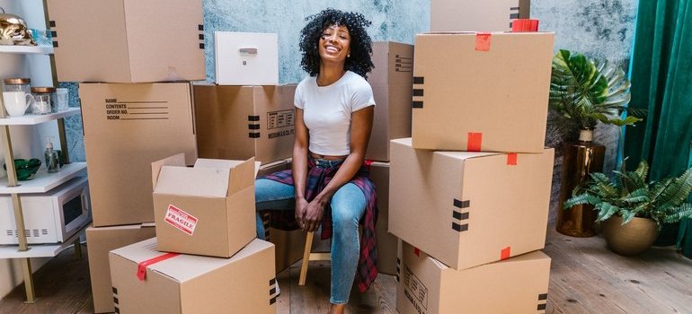woman surrounded by boxes
