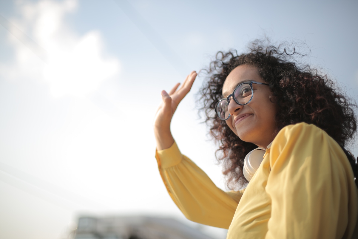 young woman wondering How to meet neighbors after moving