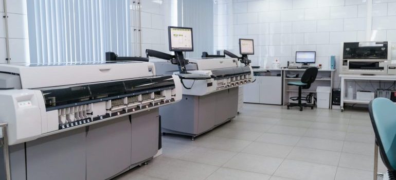 An office space with printers and scaners