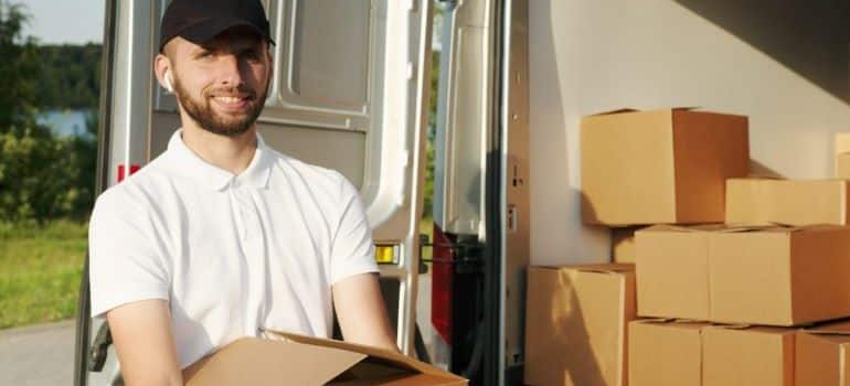 a guy unloading the moving truck