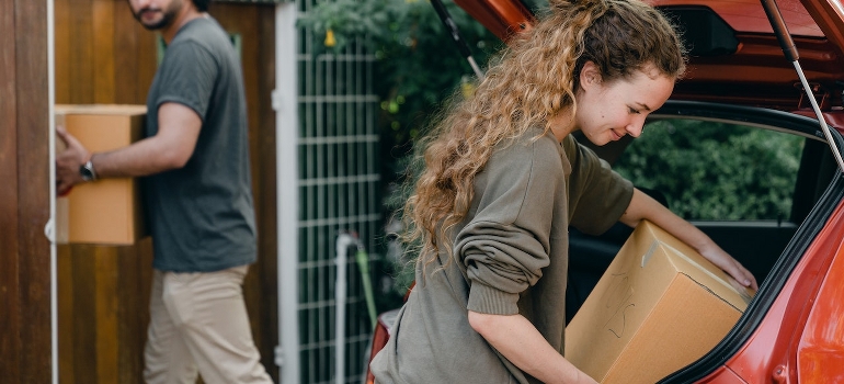 A couple unpacking their car