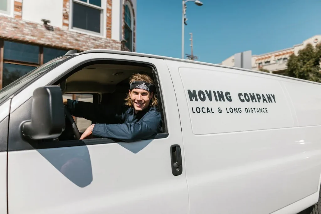 a man driving a moving van