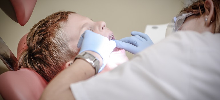 kid at a dentist trying to decide whether to relocate