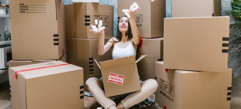A woman enyoing benefits of hiring packing and moving service in Orlando