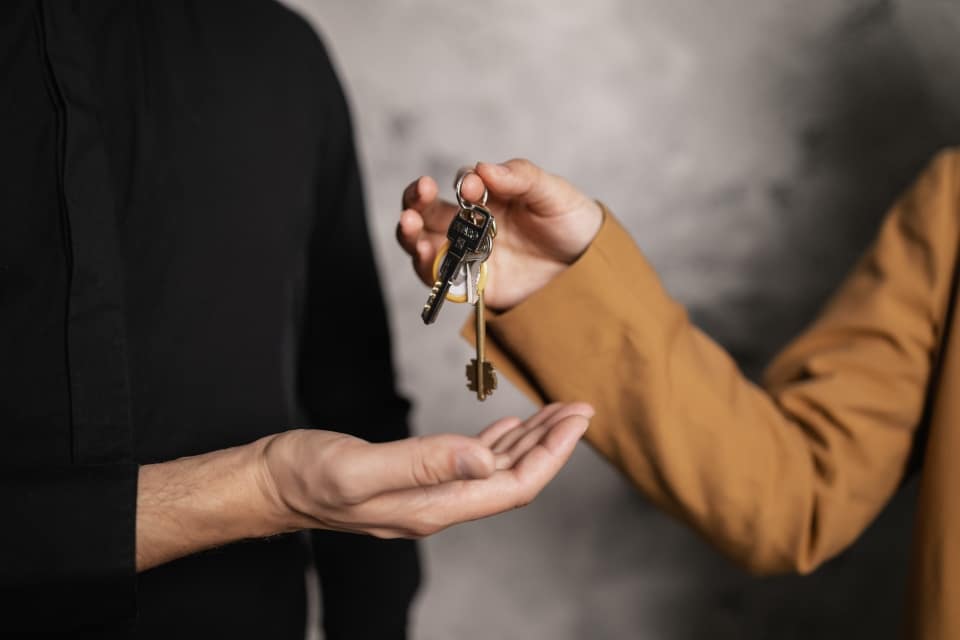 person giving someone keys