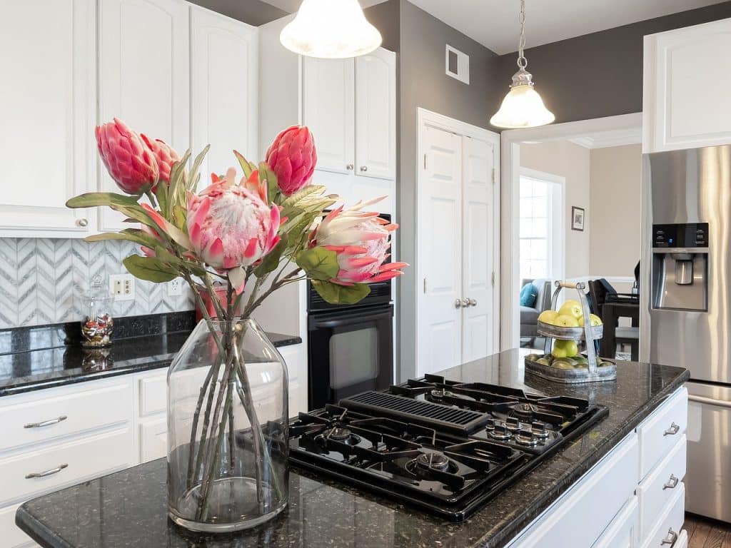 Flowers in a vase in the kitchen as a nice way to stage a Tampa home for sale