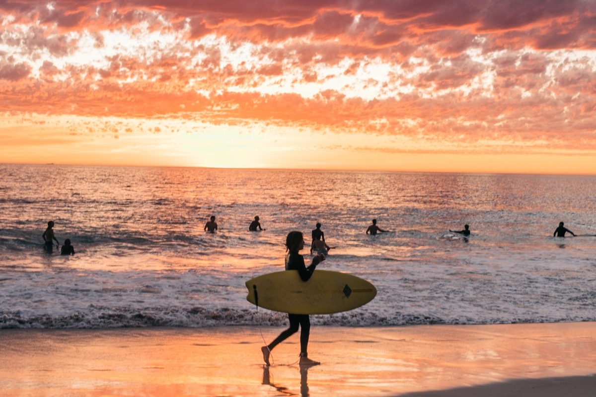 People on a beach during sunset