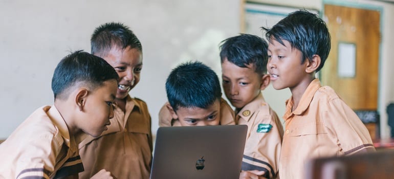 kids looking at a laptop 