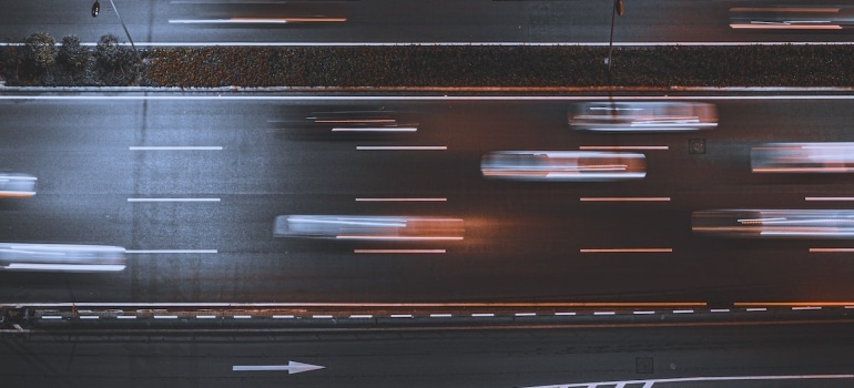 Picture of cars passing on the road 