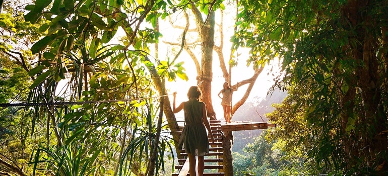 woman walking on wooden boards