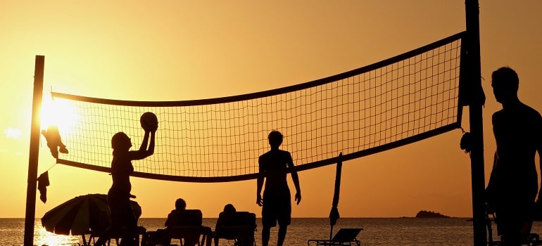 friends playing volleyball 