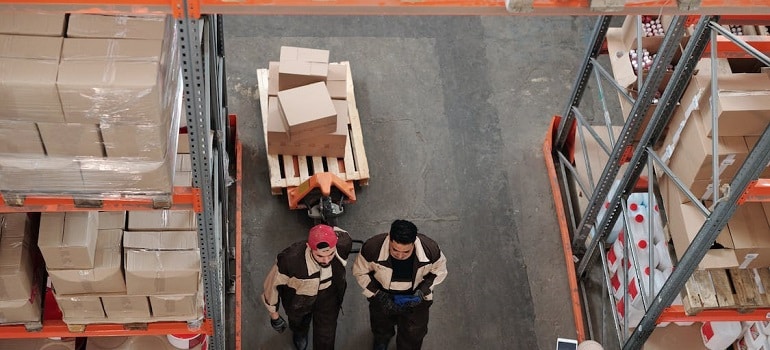 men talking in a storage unit