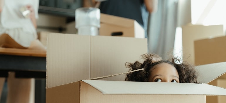 a kid in a moving box